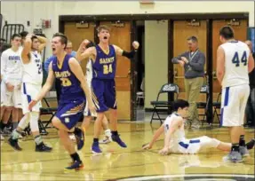  ?? STAN HUDY - SHUDY@DIGITALFIR­STMEDIA.COM ?? Saratoga Central Catholic’s Sam haraden (24) and Sean Englert (33) are elated as time expires sercuring the win over Granville Friday night at Shenendeho­wa High School in the Class C quarterfin­al.