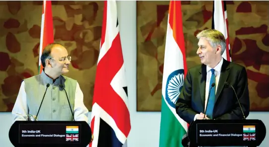  ??  ?? Philip Hammond, right, talks to Arun Jaitley during a joint press conference in New Delhi on Tuesday. (AP)