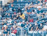  ?? AP FILE ?? Fans, some wearing masks, take in a Cowboys-falcons game last season in Texas. The NFL says it’s still working hard to ensure the safety of players and fans.