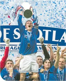  ??  ?? Mikel Arteta and Ronald de Boer celebrate as Barry Ferguson holds aloft the SPL trophy after Rangers’ dramatic success in 2003. 16 years later (above), he became manager of Arsenal