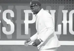  ?? SARAH STIER/GETTY ?? Zion Williamson heads to the stage after being taken first by the Pelicans in the NBA draft at the Barclays Center.