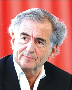  ?? (Benoit Tessier/Reuters) ?? BERNARD-HENRI LEVY said he was doing a reporting trip to the ‘killing fields’ of Libya.