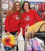  ?? SUBMITTED PHOTO ?? Sheetz employees shop in December for presents to be given to children during holiday parties across the state as part of Sheetz for the Kidz charity program. Customer donations for 2017 reached a record $618,000, up $34,000 over 2016.