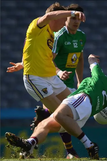  ??  ?? Kevin O’Grady shooting past Westmeath defender Mark McCallon to score Wexford’s first goal in Saturday’s