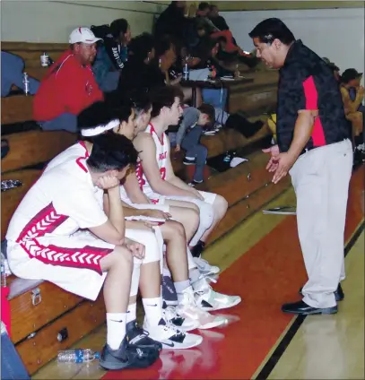  ?? PHOTOS BY BOB MINENNA ?? Upper Lake High School varsity basketball head coach Tony Arroyo questions a player who had just departed the floor during action against Anderson Valley, a non-league game played nearly a year ago today. The Cougars won 58-34.