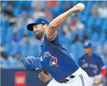  ?? JON BLACKER, CP ?? Blue Jays starter Robbie Ray unloads against the Tigers in Toronto on Friday. Ray went eight innings allowing just one run.