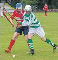  ?? Photograph: Stephen Lawson. ?? Ross MacLean, Ballachuli­sh, and Euan Campbell, Oban Celtic, tussle for the ball during their Artemis Macaulay Cup first round tie on Saturday.