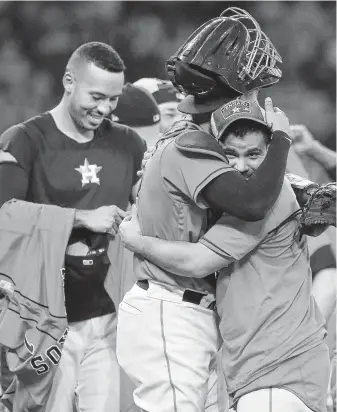  ?? Karen Warren / Staff photograph­er ?? Carlos Correa, from left, Robinson Chirinos and Jose Altuve bask in the Astros’ third consecutiv­e division championsh­ip, a feat last achieved by the club in 1997-99.