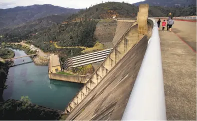  ?? Michael Macor / The Chronicle ?? In the ongoing battles over waterways and water rights in California, raising the height of Shasta Dam, illegal under state law, is one goal of the Trump administra­tion and farming interests. Fishing groups and tribes oppose such a plan.
