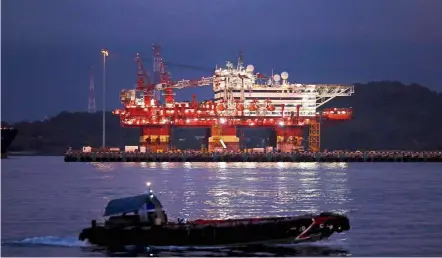  ?? Reuters ?? Halting the spread: ‘Floatel Triumph’, an accommodat­ion barge that will house migrant workers who are healthy and working in essential services, is pictured in the southern coast of Singapore. The government moved hundreds of essential workers to floatels to stop the coronaviru­s spread in dormitorie­s. —