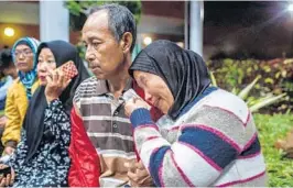  ?? ULET IFANSASTI/GETTY ?? Family members await news Monday at a crisis center at Soekarno-Hatta airport after Lion Air Flight JT 610 crashed minutes after takeoff in Jakarta, Indonesia.