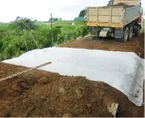  ?? Photo: GreenBridg­e.co.nz ?? Filter fabric being installed on a ‘reverse speed hump’ on Daniel and Bena’s driveway.