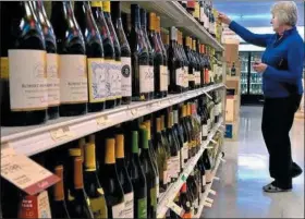  ??  ?? You might be able to score some pot along with a bottle of wine at your neighborho­od state store, if Rep. Dave Delloso gets his way.