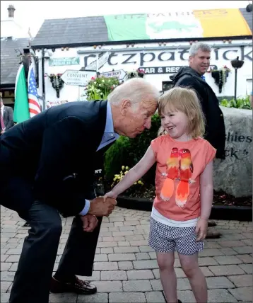  ??  ?? Vice President of the United States Joe Biden on a visit to Fitzpatric­k pub in Jenkinstow­n where he met with Aoibhinn Brennan age 5 as he met locals who turned out to meet turned out and give him a warm Irish welcome.