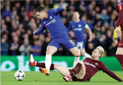  ?? Reuters ?? Barcelona’s Ivan Rakitic fighting it out with Chelsea’s Eden Hazard during the Champions League match at Stamford Bridge. —