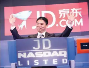  ?? VANDREW BURTON/GETTY IMAGES/AFP ?? Richard Qiangdong Liu, founder, chairman and CEO of JD.com speaks to employees as JD.com has its initial public offering on May 22, 2014.