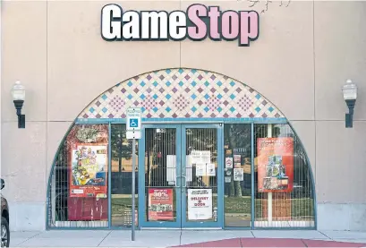  ?? LM OTERO THE ASSOCIATED PRESS ?? When a small number of retail investors on Reddit began buying up stock in video game retailer GameStop — causing a hedge fund to lose billions — it had all the makings of a great David vs. Goliath story, writes Navneet Alang. But is it?