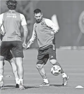  ?? LYNNE SLADKY/AP ?? Inter Miami forward Lionel Messi, right, goes through drills during a training session Tuesday in Fort Lauderdale, Fla.