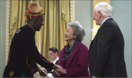  ?? ADRIAN WYLD, THE CANADIAN PRESS ?? Governor General David Johnston, right, looks on as former governor general Adrienne Clarkson speaks with Gervais Manfouo Paguem Tuesday in Ottawa.