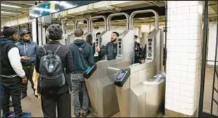  ?? ?? Two men hurled insults at cops after they were caught trying to “double up” at the turnstiles in an attempt to pay just one fare inside the Bed-Stuy station on Friday.