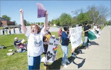  ?? ANDY SHUPE NWA DEMOCRAT-GAZETTE ?? Students from Farmington junior high and high schools chant Friday during a protest along Main Street near the Farmington Junior High School after a student was allegedly attacked Tuesday, April 27, at the school by at least one fellow student.