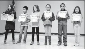  ?? Photo by Mike Eckels ?? Students of Bobbi Turner’s fourth-grade class were recognized for making the second quarter honor roll during an assembly in the cafeteria of Decatur Northside Elementary School Jan. 13. Those receiving the honors were Heaven McGarrah, Abraham Cordova,...