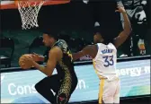  ?? NAM Y. HUH — THE ASSOCIATED PRESS ?? Chicago Bulls center Wendell Carter Jr., left, rebounds the ball against Warriors center James Wiseman during the first half in Chicago on Sunday.