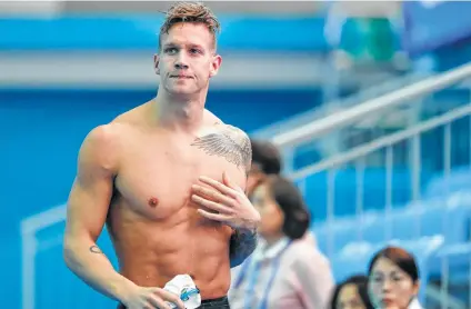  ?? Lee Jin-man / Associated Press ?? American Caeleb Dressel, who has won two of what could be eight gold medals at the world championsh­ips, isn’t as driven to succeed as the legendary Michael Phelps, who won a record eight golds at the Olympics on 2008.