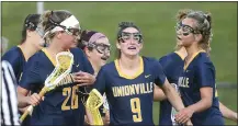  ?? PETE BANNAN — MEDIANEWS GROUP ?? Unionville players rally around (9) Cate Constable reacts after she scored in the first half of their Chest-Mont match-up against West Chester Rustin Thursday evening.