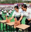  ?? PICS/MPOST ?? Left to right: Delhi Police Commission­er Amulya Patnaik with other officers at the event. Participan­ts display martial art skills