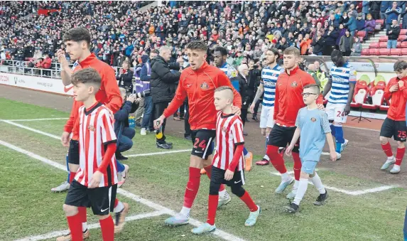  ?? ?? Players and mascots stride out of the Stadium of Light tunnel before Sunderland’s recent victory over Reading.