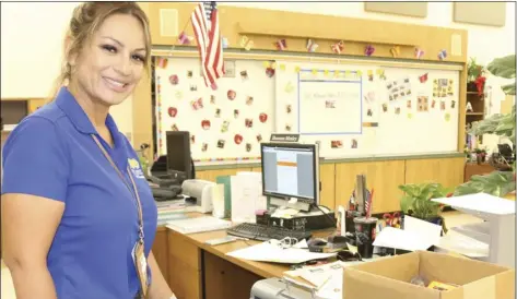  ?? WILLIAM ROLLER PHOTO ?? Lupe Gonzalez, special education instructor for the visually impaired at Imperial County Office of Education, Del Rio campus works with an embosser that transcribe­s type into Braille for students who are blind.