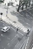  ??  ?? A man believed to be the attacker walks with his hands in the air in Liege, Belgium.