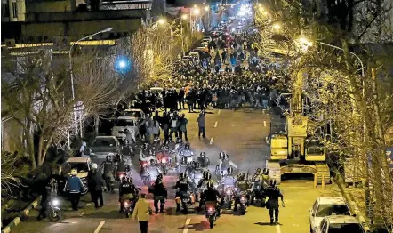  ?? AP ?? Iranian police line up against people protesting over the downing of the Ukrainian passenger plane last week. Mark Almond says the lack of coherent strategic thinking in the regime should worry the West, as well as Iranians.