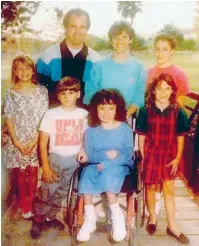  ??  ?? By 1991, the Ruckel family had adopted two children: Izidor (front, left) and Izabela (in the wheelchair)