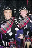  ??  ?? Vancouver Police Band’s David Glover and Tim Fanning played Atholl Highlander­s to lead in Courage to Come Back head-table guests.