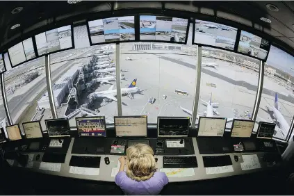  ?? THOMAS LOHNES/ AFP/ GETTY IMAGES ?? A control tower at Frankfurt internatio­nal airport. Studies show most night- shift workers, not just controller­s, face difficulti­es staying awake no matter how much sleep they’ve had. That’s especially true if they aren’t active or have work that is...