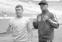  ?? MARTA LAVANDIER/AP ?? Boxers Saul“Canelo”Alvarez, left, and Avni Yildirim pose for photos at Hard Rock Stadium on Monday. Saturday’s fight will be the first boxing event at the 34-year-old venue.