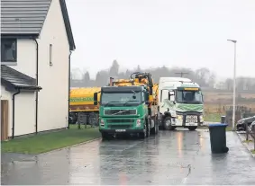  ??  ?? Works Contractor­s Enviroclea­n clear drains at the Lathro Meadows developmen­t in Kinross in January 2021