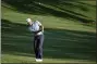  ?? GERALD HERBERT — THE ASSOCIATED PRESS ?? Lee Westwood, of England, chips to the green on the ninth hole during the second round of the The Players Championsh­ip golf tournament Friday, in Ponte Vedra Beach, Fla.