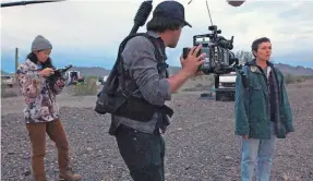  ?? PROVIDED BY SEARCHLIGH­T PICTURES/AP ?? “Nomadland” director Chloé Zhao, left, director of photograph­y Joshua James Richards and actress Frances McDormand work.