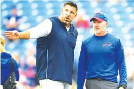  ?? AP PHOTO/ADRIAN KRAUS ?? Tennessee Titans coach Mike Vrabel, left, talks to Buffalo Bills coach Sean McDermott prior to their game in 2018 in Orchard Park, N.Y.