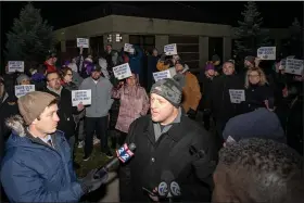  ?? GREG GREINER — FOR THE MACOMB DAILY ?? Surrounded by fellow parents, Craig Cole addresses media at Tuesday night’s gathering in front of De La Salle Collegiate High School.