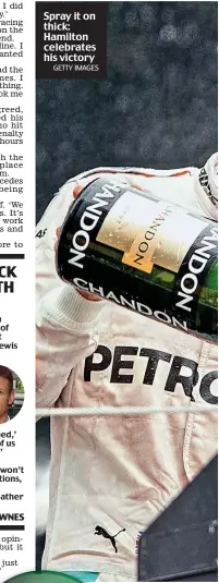  ?? GETTY IMAGES ?? Spray it on thick: Hamilton celebrates his victory