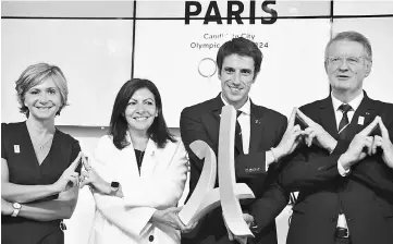  ??  ?? (From left) French President of the Ile de France region Valerie Pecresse, Mayor of Paris Anne Hidalgo, co-presidents of the Paris bid for the 2024 Olympics Tony Estanguet and Bernard Lapasset react at the end of the IOC Evaluation Commission session...