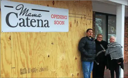  ?? CHAD FELTON — THE NEWS-HERALD ?? Frank Catena and his aunts, Fran Lausin, center, and Rina Catena stand in front of the soon-to-be reopened Mama Catena Ristorante. Last May, a fire destroyed the eatery’s interior. The family-owned restaurant, at 711 Babbitt Road in Euclid, originally...