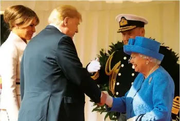  ??  ?? AWKWARD INTRODUCTI­ON Instead of bowing to the queen, Trump chose to shake her hand while his wife, Melania, looked on. Many royal fans were also offended that he couldn’t bother to button up his jacket for the formal occasion, and pointed out that his suit looked like it needed an iron.