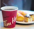  ?? JONATHAN HAYWARD/ THE CANADIAN PRESS ?? Tim Hortons’s distributi­on system changes are expected to create 150 jobs and streamline restaurant operations to provide a uniform standard of service nationwide.