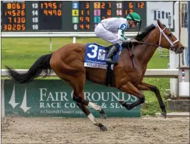  ?? LOU HODGES JR. — THE ASSOCIATED PRESS ?? Wells Bayou, ridden by jockey Florent Geroux, wins the Louisiana Derby Saturday, March 21, 2020, at Fair Grounds race course in New Orleans.