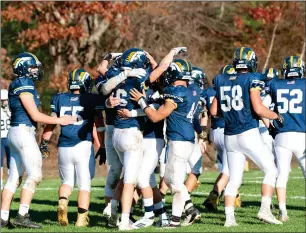  ?? Photo by Michelle Menard ?? The undefeated Burrillvil­le football team celebrates after claiming its second straight Division II-B title with a 14-13 victory over second-place Westerly Saturday at Alumni Field.